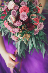 Wedding in purple. An unusual bouquet of the bride.