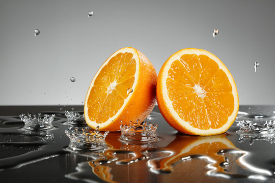 Fototapeta Orange slices with water drops