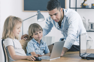 Fototapeta premium Children using laptop during classes