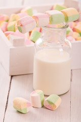 Marshmallows on wooden table. 