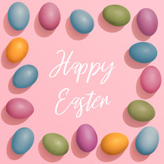 Colourful Ester Egg greeting card with text Happy Easter on pink background