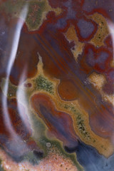 Polished multicolor ocean jasper from Madagascar background, texture 