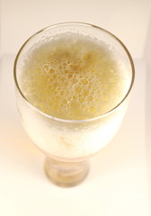 beer froth in a glass close up