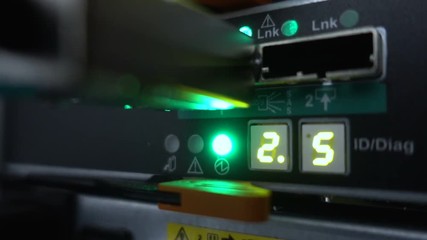 Flashing lamps. Fiber Optical connector interface. Rack Mounted Servers In A Server Room, Server rack link cable. - Powered by Adobe
