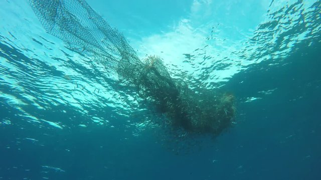 Ghost net. Abandoned fishing net in ocean