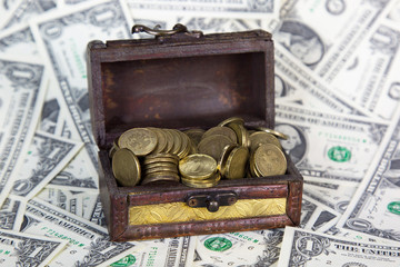 An old chest with money. Chest full of jewelry of metal coins and other treasures