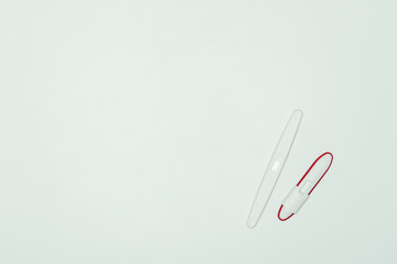 top view of two pregnancy tests isolated on grey