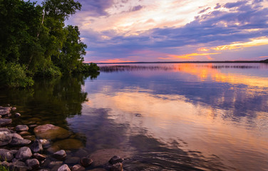 Reflecting clouds and restive colors of a tranquil sunset in Minnesota