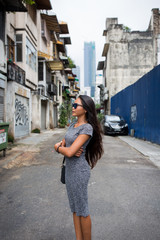 Fototapeta na wymiar Young Asian girl walking in the city. 