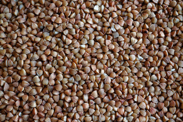 Buckwheat texture high-quality photograph of premium buckwheat groats The concept of proper nutrition and healthy lifestyle. Top view, close-up as background or texture