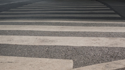 Zebra cross walk on asphalt road.