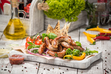 Grilled sausages and vegetables