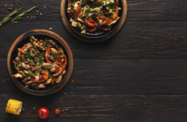 Roasted meat and vegetable on wooden table