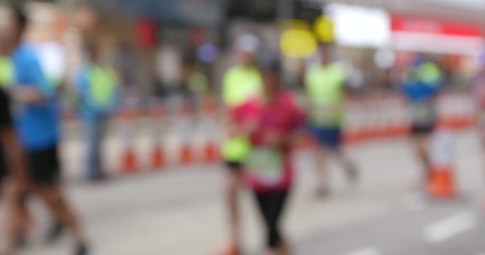 Blur view of people running in the marathon