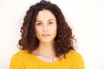 Close up beautiful young woman against white background