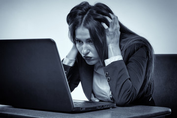 Frustrated businesswoman contemplating failure