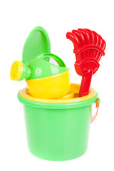 Fototapeta na wymiar Beach bucket with toys isolated on white