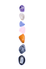 Set of seven healing chakra stones for crystal healing, isolated on white background 