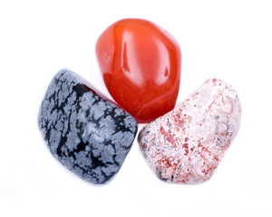 Sacral chakra healing tumbled crystal set, isolated on white background