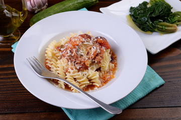 Fusilli pasta dish in the sauce with carrots and zucchini

