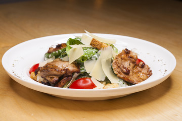 Caesar Salad plate with chicken breast pieces