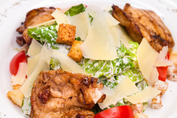 Caesar Salad plate with chicken breast pieces