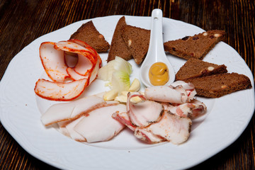 Three kinds of salad with croutons with garlic and onion on a plate