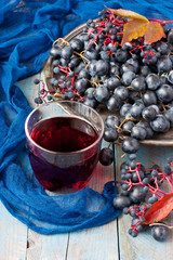 Group of fresh  grape  and juice on wooden  background
