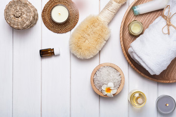 Spa accesories and cosmetcis on the white table