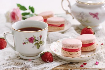 Homemade Pink Macaroons or Macarons with a cup of coffee