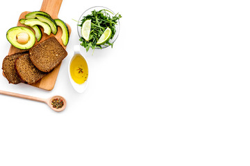 Fototapeta na wymiar Avocado toast for light healthy breakfast on white background top view copy space