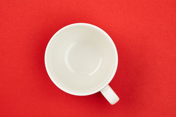 Cup. White. Isolated on a red background. For your design.