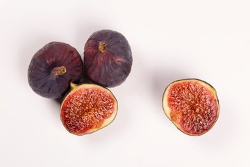 Fresh figs isolated on white background. Figs cut in half, in section