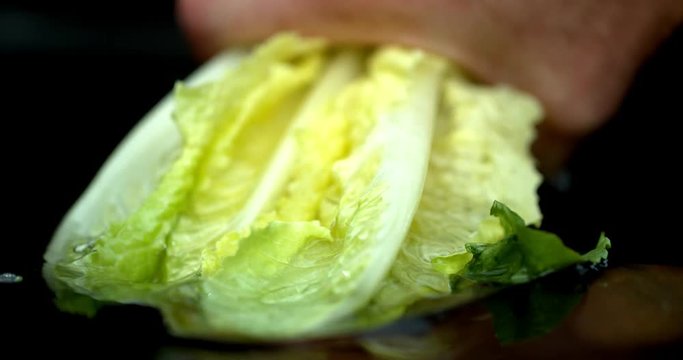 Lettuce green leaf salad slow motion water washing shot on Phantom Flex 4K