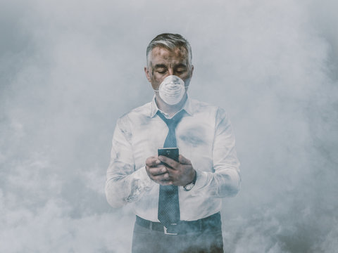 Businessman having a phone call and toxic smog