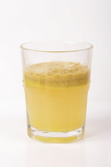 A glass of fresh apple juice isolated on white background