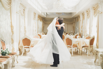 Romantic couple dancing and kissing on their wedding