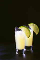 Italian lemon lime liqueur limoncello with ice and mint