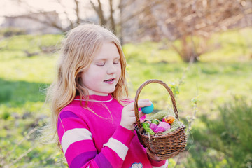 happy girl with Easter eggs outdoor