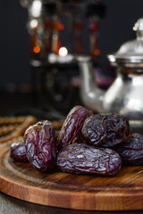 Dates for iftar on wooden board for ramadan month.