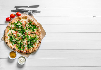 Italian pizza on white wooden background