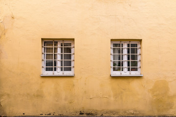 Fototapeta na wymiar A pair of unique looking windows in Europe. 