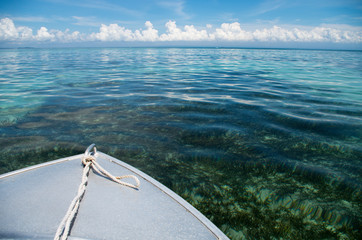 Boat cruise with crytal clear water on Sumbawa, Indonesia - horizontal.