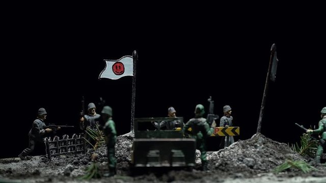 Diorama two detachments of toy soldiers are fighting for territory