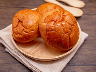 Close up bread s in wooden dish and wooden table;Food,bakery concept