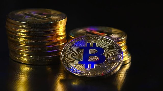 Golden bitkoyny new virtual money on a black background. The concept of crypto currency