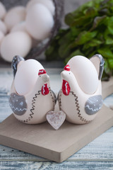 Eggs in handmade hens trays over the wooden background. Easter postcared concept.