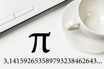 International Pi Day. On a white table a laptop and a cup. - obrazy, fototapety, plakaty