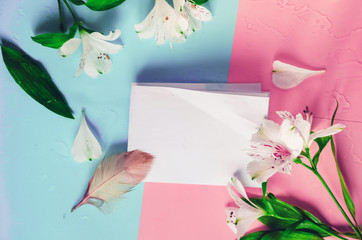 empty template. note for the holiday. flowers, white lilies. pen. Pastel colors background
