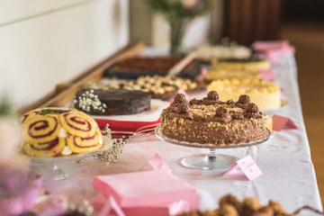Cakes on buffet on a wedding, sweet desserts baked with nuts, Nusshörnchen to eat after dinner on a birthday